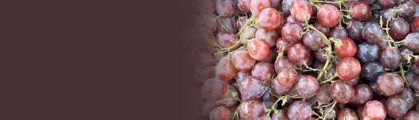 Close up of raw organic sweet red grapes background, wine grapes texture, Healthy fruits Red wine grapes background, top view fresh local produce, good for your multimedia content creation