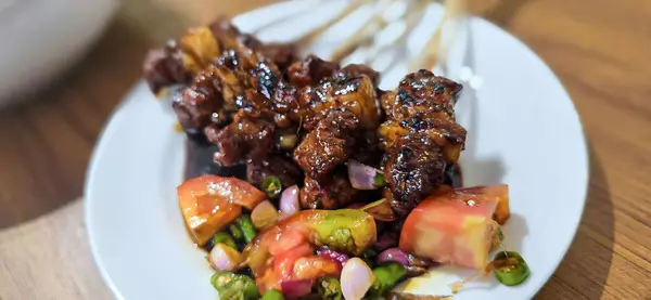 stock image grilled mutton or lamb satay, or local Indonesian called Sate Kambing or known as Mutton meat Satay cooked in traditional stove, good for digital recipe content creation