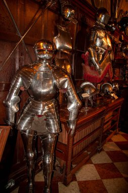 Medieval knight suit of armor protection in castle in Britain with complete parts, ancient steel metal armour used by knights crusaders in ancient war, good for multimedia content creation, THIS IS NOT AI IMAGE, Please Check the EXIF DATA clipart