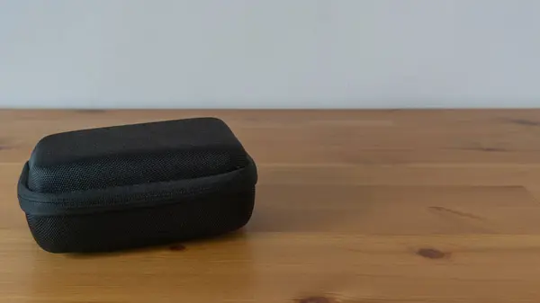 Stylish black storage case, textured design, portable convenience