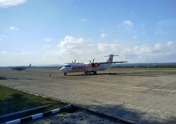 stock image Kupang, Indonesia - June 28, 2023 : An airplane parked at El Tari international airport in Kupang