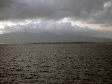 Bali, Indonesia - 15 August, 2024 : The atmosphere of ferry traffic at the Gilimanuk ferry port in the morning. clipart