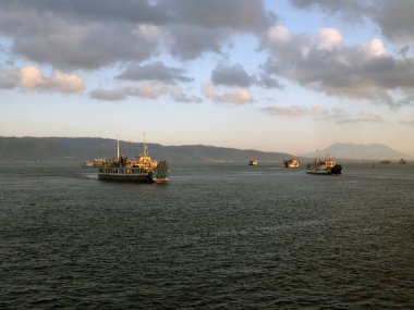 Bali, Indonesia - 15 August, 2024 : The atmosphere of ferry traffic at the Gilimanuk ferry port in the morning. clipart