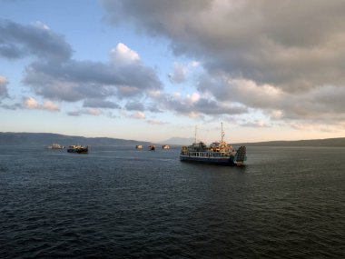 Bali, Indonesia - 15 August, 2024 : The atmosphere of ferry traffic at the Gilimanuk ferry port in the morning. clipart