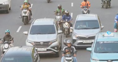 Crowd of workers heading to public transportation in the afternoon in Jakarta, Indonesia August 20, 2025