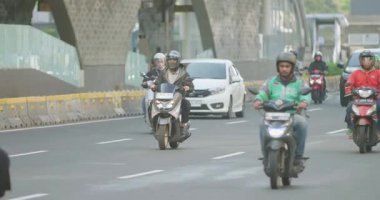 Crowd of workers heading to public transportation in the afternoon in Jakarta, Indonesia August 20, 2025