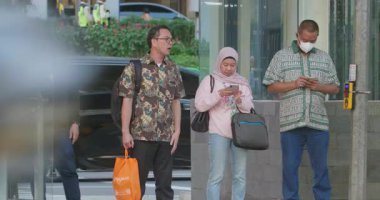 Crowd of workers heading to public transportation in the afternoon in Jakarta, Indonesia August 20, 2025
