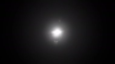 4k Abstract Center Black and White optical lens flare Light burst animation abstract  Background with Halo effect rotation loop. Animation seamless loop of light lens flare spinning shine ring. Halo around. Shimmer Flickering Spotlight.