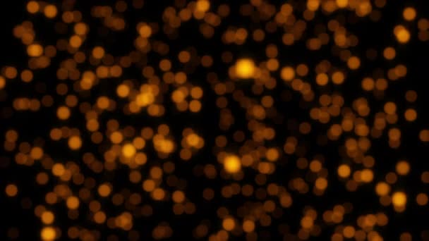 Петля Світиться Анімацією Золотисто Оранжевих Частинок Боке Чорному Абстрактному Тлі — стокове відео