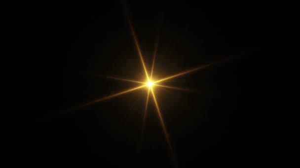 ループセンター回転ちらつきグローゴールドスターライト光学レンズは 黒の背景に光沢のあるアニメーションアートをフレア 照明ランプ線はダイナミック明るいビデオ映像に影響します 金光学フレアの動き — ストック動画