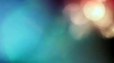 Soyut döngü renkli ışık sızıntısı ekran projesi örtüsü için animasyon arkaplanı parlıyor. 4K pürüzsüz döngü güzel ışık sızıntısı siyah arkaplan üzerinde yansıması renkli sarı mavi tonlar. 