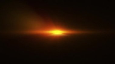 Soyut döngü merkezi turuncu altın optik lens parıltısı siyah arkaplan üzerindeki ışık patlaması. 