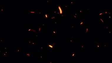 Soyut döngü animasyon turuncu ateş parlaması ekran örtüsü için toz parçacıkları eylem arka planına neden olur. Parçacık tozu, siyah zemin üzerinde rastgele kıvılcımlar yakıyor alfa kanal geçişleri 444  . 