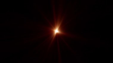 Dönen yıldız dairesi turuncu altın ışınlar radyal optik mercek parlamaları, ekran projesi için siyah zemin üzerinde ışık animasyonu sanatı parlatmaktadır. Lamba ışınları dinamik, parlak video görüntülerini etkiler. 