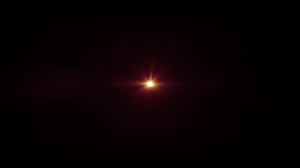 ループセンターグローゴールドオレンジの赤い星は スクリーンプロジェクトのオーバーレイのための黒い抽象的な背景の光学レンズフレアアニメーションアートを照らします 照明ランプの光線効果動的で明るいビデオ — ストック動画