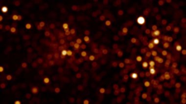 Soyut döngü hareketinin arka planı siyah arkaplanda altın turuncu bokeh parçacıkları parlıyor. 4K 3D döngü animasyonu. Parıldayan Parçacıklar Bokeh Parçacıkları yılbaşı, yeni yıl, tatil, düğün için döngü efekti.