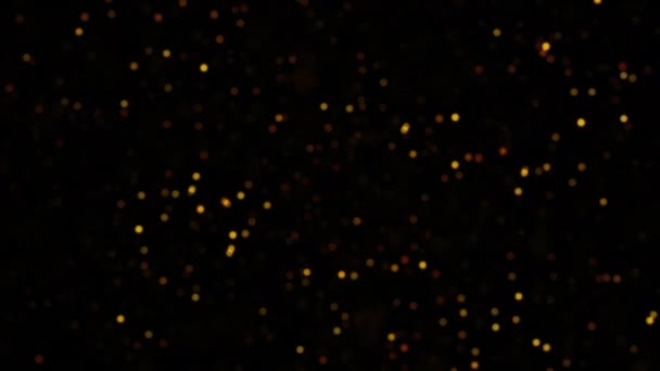 Siyah Soyut Arkaplan Üzerinde Turuncu Altın Renkli Sahte Parçacıklar Parlıyor — Stok video