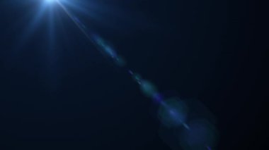 Koyu mavi soyut zemin üzerinde sol üstten sağa hareket eden parlak optik ışık animasyonu