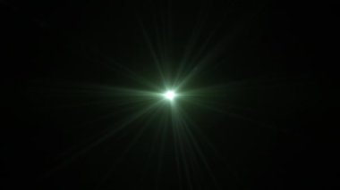 Soyut döngü merkezi parıldayan gren yıldızı optik ışık merceği siyah arkaplanda yanıp sönen animasyon. 