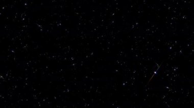 Siyah soyut arka planda parlayan parlak yıldız parçacıkları hareketli güzel bir döngü. Siyah arkaplan hareketindeki altın yıldız parçacığı başlıkları sinematik arkaplan döngüsü. 