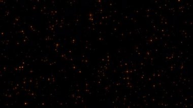 Altın yıldız parçacıkları siyah soyut arkaplana düşer. 4K 3D ateşli parlayan kor yanan kül parçacıklarının animasyonu. 