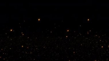 Soyut animasyon, siyah arkaplanda akan altın turuncu yıldız toz parçacıkları parlıyor. 4K 3D kaotik hareketli mavi parçacıklar havada uçuşuyor.