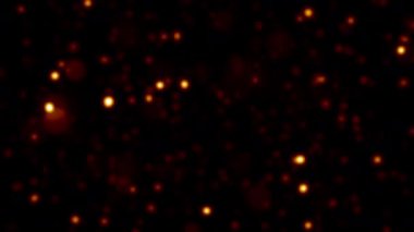 Soyut animasyon döngüsü, siyah arkaplanda akan kırmızı bokeh parçacıklarını bulanıklaştırdı. 4K 3D kaotik hareketli altın parçacıkları havada uçuşuyor.