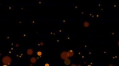 Güzel döngü animasyonu turuncu bokeh parçacıkları siyah soyut arkaplanda akıyor. Kış Noel 'i için yeni yıl temalı 4K kusursuz döngü