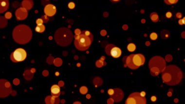 Soyut turuncu parlak kırmızı bokeh parçacıkları siyah arkaplanda akış hareketini döngüye sokun. 4K 3D ateşli kırmızı turuncu parlak uçan bokeh kül parçacıklarının animasyonu.
