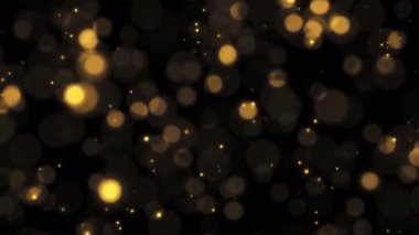 Soyut döngü animasyonu, siyah arkaplanda uçan altın renkli balon parçacıkları parıldatır. 4K 3D kusursuz altın halkalı bokeh parçacıkları havada uçuşuyor..