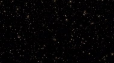 Soyut animasyon döngüsü yüzen altın yıldızların toz zerreleri siyah arkaplanda akıyor. 4K 3D kusursuz altın halkalı bokeh parçacıkları havada uçuşuyor..