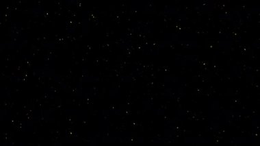 Siyah soyut arkaplanda parlayan yeşil toz yıldız parçacıkları düşüyor. Alevli, yeşil, parlayan, yanan kül parçacıklarının canlandırması.