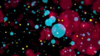Soyut döngü animasyonu sarı kırmızı mavi bokeh parçacıkları siyah arkaplana düşüyor. 4K 3D sarı kırmızı bokeh parçacıkları havada uçuşuyor. 
