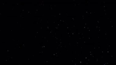 Soyut animasyon beyaz yıldız parçacıkları siyah arkaplanda havada uçuşuyor. 4K 3D kusursuz altın halkalı bokeh parçacıkları havada uçuşuyor..
