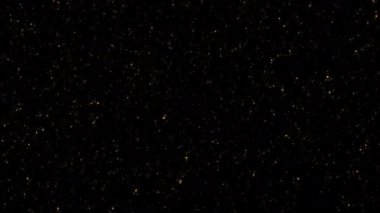 Döngü titreşen altın tozlu yıldız parçacıkları kara soyut arkaplan üzerine düşen animasyon hareketi. Siyah arkaplan hareketindeki altın yıldız parçacığı sinematik başlıklar