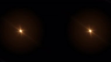 Soyut turuncu optik parlak mercek siyah arkaplanda yanıp sönen bir animasyon. 4K kusursuz döngü dinamik parlak yıldız ışığı etkisi. Yıldız ışığı çizgileri