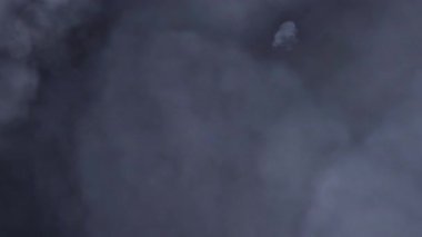 Abstract seamless loop white grey smoke cloud stream moveing on black background.Cinematic animation background for mystery,horror, Halloween environment 