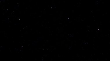 Döngü parıldayan yıldızlar parçacıkları kara zemin üzerinde hareket eden animasyon uzay seyahati soyut. Uzay, solucan deliği zaman tünelinden geçiyor. Sonsuz siber teknoloji girdap akışı 