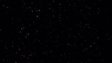 Kıvılcımlar saçan parlak altın yıldız parçacıkları siyah soyut arkaplanda sönük animasyon oluşturur. Yeni yıl için romantik arkaplan animasyonu. 