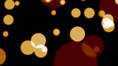 Soyut animasyon, siyah arkaplana düşen turuncu altın bokeh parçacıkları parlıyor. 4K 3D altın turuncu bokeh parçacıkları havada uçuşuyor. 
