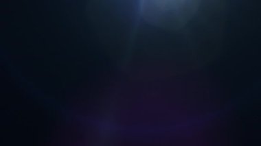 Glow blue optical flare light burst animation moving from top center  to top right on dark blue  abstract background for screen project overlay.