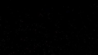 Soyut döngü animasyonu yanıp sönen turuncu yıldız parçacıkları siyah arkaplanda uçuyor. 4K 3D kusursuz altın halkalı bokeh parçacıkları havada uçuşuyor.