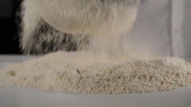 sifting flour, chef sifting flour to make bread dough