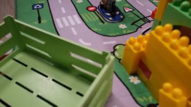 playing toys, child playing toys on game carpet