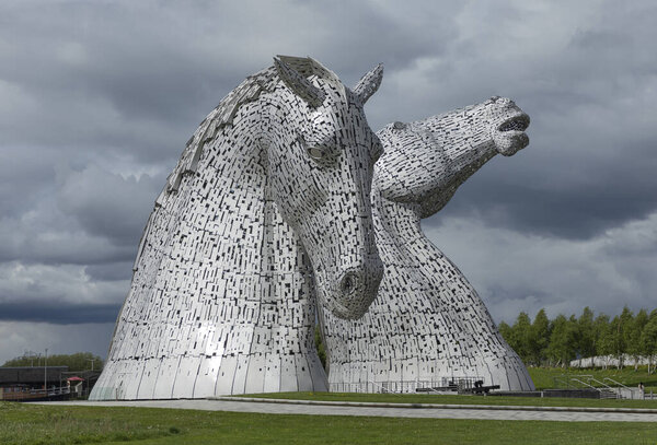 Falkirk, Scotland - May 10th 2023 - The Kelpies sculpture sat the junction of the two canals 