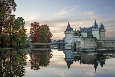 Sully-Sur-loire, Loriet, Loire Valley, France - November 5th 2024 - Chateau of Sully-Sur-Loire surrounded by a moat in the Autumn and beautiful reflections clipart