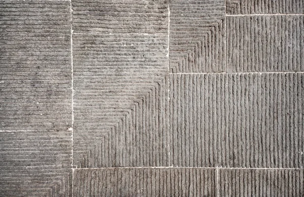水平と垂直の平行溝が薄い石のブロックの異常な背景 — ストック写真