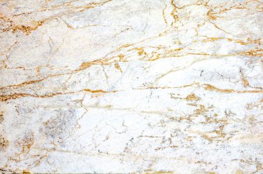 Çok sayıda düzensiz turuncu damarlı mermer ışık yüzeyi