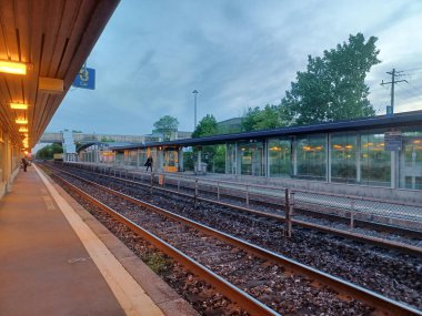 Burlington, ON, Canada  July 2, 2024: View at the Burlington GO train station in evening time. clipart