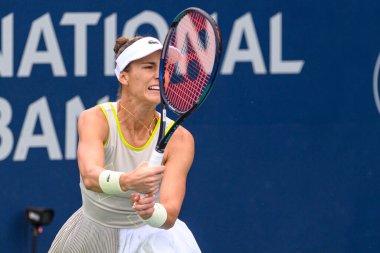 Toronto, ON, Canada - August 4, 2024: Bernarda Pera (USA) plays against Miriam Bulgaru (ROU) during the qualifying match of the National Bank Open at Sobeys Stadium clipart